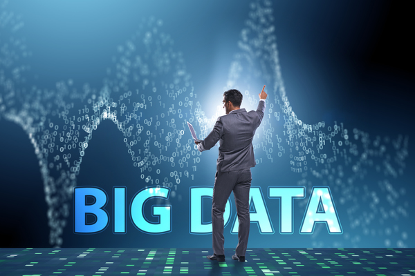 Best data science software is depicted by a data scientist working next to the words 'big data'.